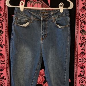 Dark ripped blue jeans